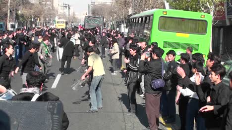 Protesters-march-down-a-busy-street-in-Iran-2