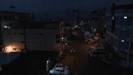 Activity-in-the-parking-area-between-two-apartment-buildings-is-shown-in-time-lapse-from-night-until-morning