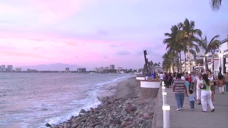 Malecon-in-Puerto-Vallarta-Mexico-We-see-the-sculptures-on-the-beach-walk-the-tourism-resort-buildings-in-the-horizon