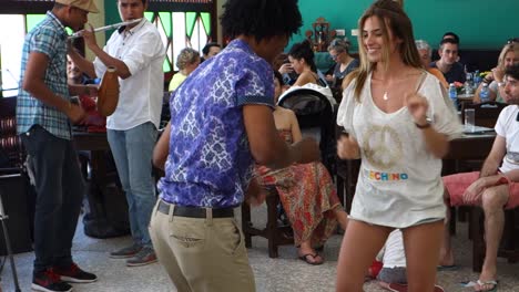 Cubans-dance-in-a-colorful-bar-in-Havana