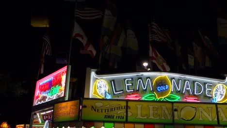 Establishing-shot-of-a-food-stall-offering-lemonade-at-an-amusement-park-carnival