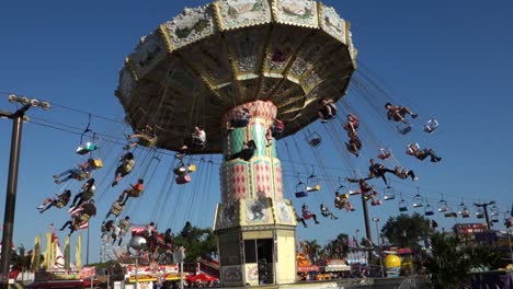 A-merry-go-round-spins-with-riders-against-the-sky-1