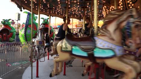A-merry-go-round-spins-with-riders