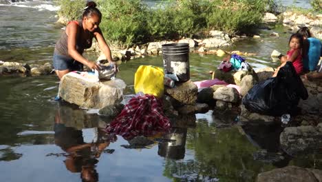 Women-wash-clothes-in-a-river-in-a-third-world-country