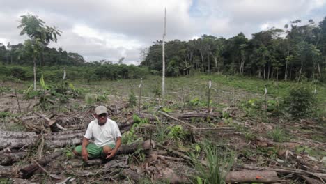 Peruvian-man-sitting-in-deforested-area