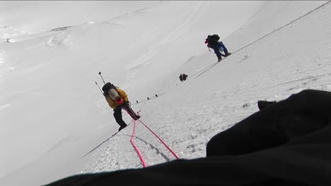 Climbers-climbing-down-steep-slope