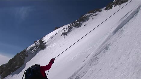Climber-descending-down-slope
