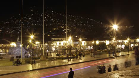 Plaza-de-armas-with-people-and-cars-passing