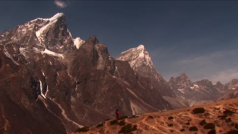 Trekker-against-mountain-backdrop