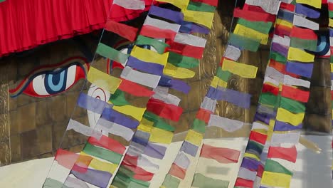 Prayer-flags-streaming--in-front-of-Adi-Buddha