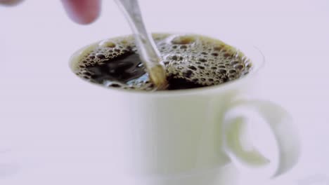 Coffee-is-stirred-in-a-cup