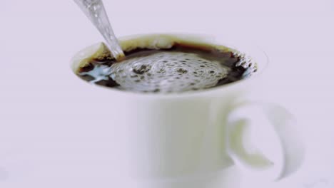 Milk-or-cream-is-poured-into-coffee