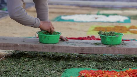 Locals-decorate-an-alfombra-or-carpet-during-Semana-Santa-Easter-week-in-Antigua-Guatemala-2