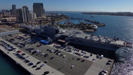 Orbiting-aerial-of-the-USS-Midway-Navy-aircraft-carrier-museum-in-San-Diego-harbor-California