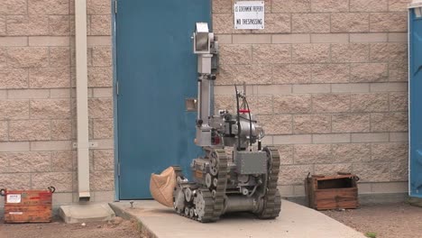 A-Bomb-Disposal-Squad-Uses-A-Remote-Control-Robot-To-Defuse-A-Hidden-Explosive