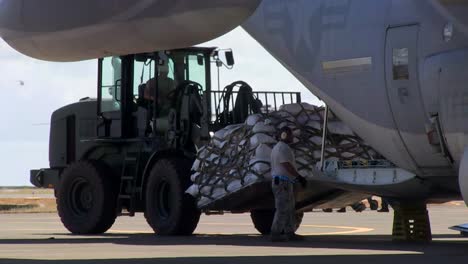 Emergency-Relief-Supplies-Are-Offloaded-From-A-Transport-Plane-During-Typhoon-Haiyan-In-The-Philippines