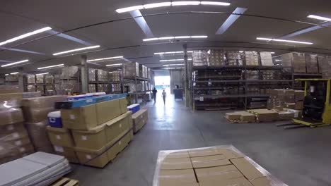 High-Speed-Pov-Shot-Traveling-Through-A-Large-Warehouse-Facility-1