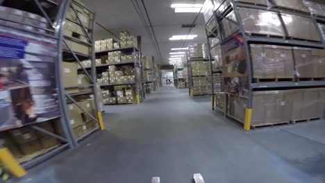 High-Speed-Pov-Shot-Traveling-Through-A-Large-Warehouse-Facility-3
