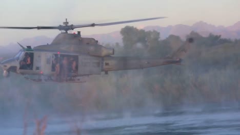 Paratroopers-Jump-From-A-Low-Flying-Helicopter-Into-A-Small-Lake