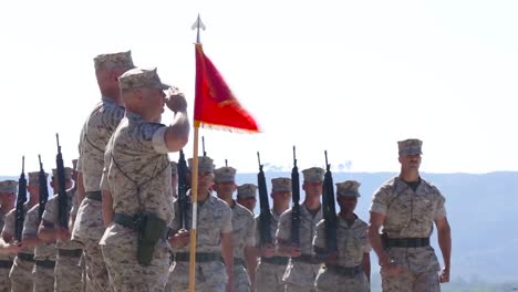 Marine-Corps-Troops-Salute-In-A-Ceremony-On-A-Runway-At-An-Airbase-1