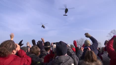 People-Wave-As-The-President-Of-The-Us-Flies-Over-In-Marine-One