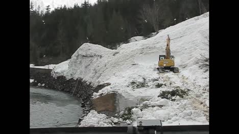 An-Avalanche-Has-Buried-A-Road-And-Is-Being-Cleared-By-A-Steam-Shovel