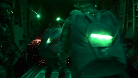 Paratroopers-Jump-From-A-Plane-At-Night-In-Night-Vision