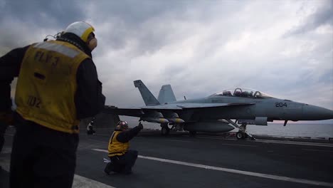 A-Fighter-Jet-Takes-Off-From-An-Aircraft-Carrier-4