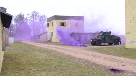 Troops-Practice-Urban-Warfare-And-Hostage-Rescue-In-A-Mock-Village-With-Purple-Teargas
