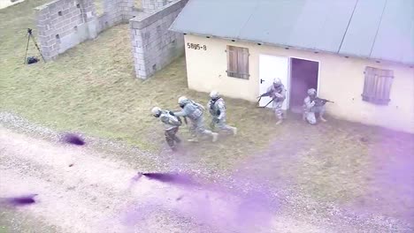 Troops-Practice-Urban-Warfare-And-Hostage-Rescue-In-A-Mock-Village-With-Purple-Teargas-1