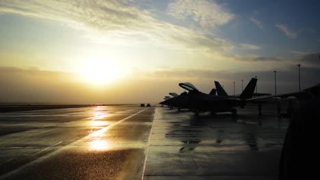 Beautiful-Dolly-Shot-Around-Air-Force-Pilot-At-Sunset-With-His-Fighter-Jet
