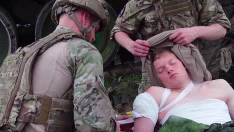 An-Injured-Soldier-Is-Treated-On-The-Battlefield