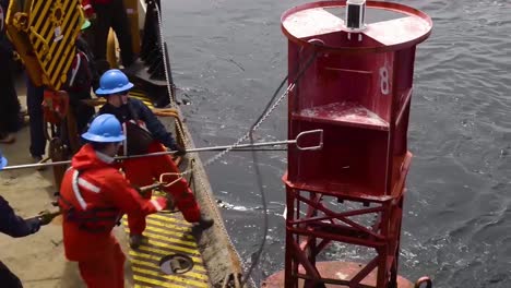 Coast-Guard-Personnel-Maintain-And-Clean-Ocean-Buoys