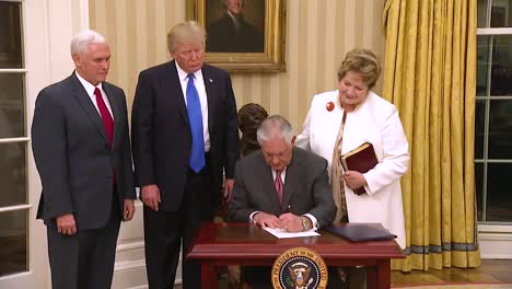 Us-Secretary-Of-State-Rex-Tillerson-At-His-Swearing-In-Ceremony-In-The-White-House-With-Vice-President-Pence-And-President-Trump-Looking-On