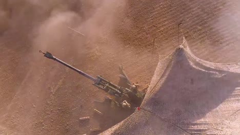 Aerial-Of-Soldiers-Firing-Heavy-Artillery-In-The-Battlefield-2