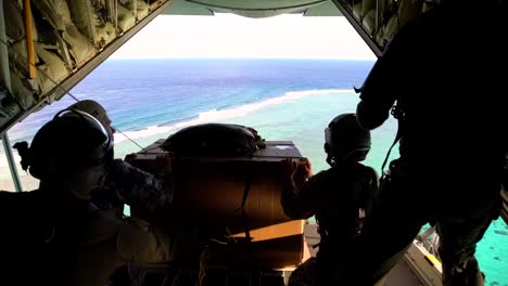 Airmen-Of-The-Royal-Australian-Air-Force-Take-Part-In-Operation-Christmas-Drop-Sending-Supplies-By-Parachute-Over-The-Ocean-From-A-C130J-Super-Hercules