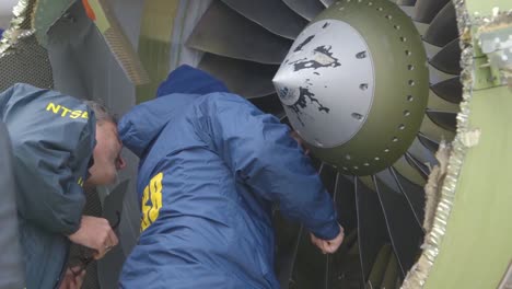 Ntsb-Inspectors-Look-At-An-Aircraft-Engine-Which-Expoded-In-Midair-During-A-Southwest-Airlines-Flight-1