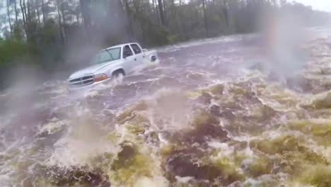 A-Search-And-Rescue-Team-Rescues-A-Man-Trapped-In-Flood-Waters-In-His-Truck-During-Hurricane-Florence-3