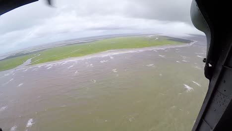 Search-And-Rescue-Personnel-From-The-Coast-Guard-Fly-Above-The-South-Carolina-Shore-During-Hurricane-Florence