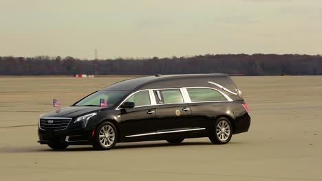 A-Hearse-Transporting-The-Body-Of-George-H-W-Bush-Arrives-At-Air-Force-One-To-Transport-The-Former-President-To-His-Final-Resting-Place-During-A-State-Funeral