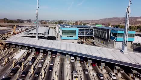 Rising-Aerial-Over-The-San-Ysidro-Tijuana-Us-Mexico-Border-Crossing-With-Cars-Lined-Up-For-Miles