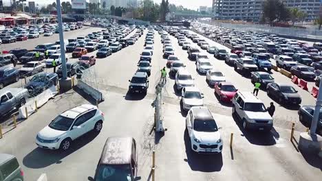 Border-Patrol-Agents-Wait-To-Inspect-A-Line-Of-Cars-At-The-San-Ysidro-Tijuana-Us-Mexico-Border-Crossing-1
