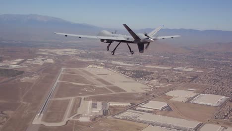 An-Unmanned-Aerial-Drone-Flies-Above-The-Desert-In-This-Military-Mission-Aerial