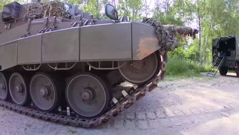 A-Camouflaged-Army-Tank-Rolls-Through-A-Forest