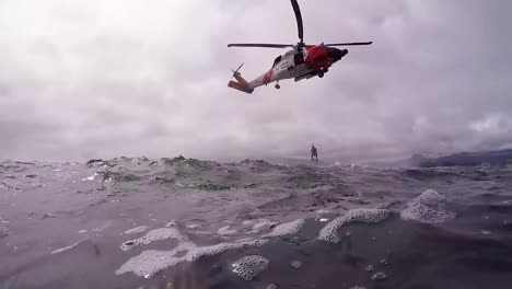 Pov-From-The-Water-Of-A-Coast-Guard-Helicopter-Search-And-Rescue-Mission-In-Open-Ocean