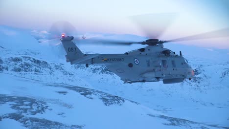 Aerial-Shot-Of-A-Norwegian-Navy-Helicopter-Patrolling-Northern-Regions-In-Winter