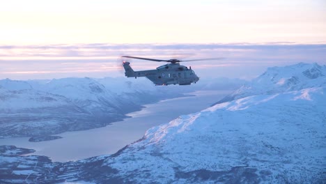 Aerial-Shot-Of-A-Norwegian-Navy-Helicopter-Patrolling-Northern-Regions-In-Winter-1