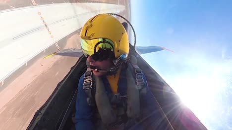 Cockpit-Pilot-Pov-Flying-A-Blue-Angels-Jet-Performing-A-Barrel-Roll-In-An-Airshow