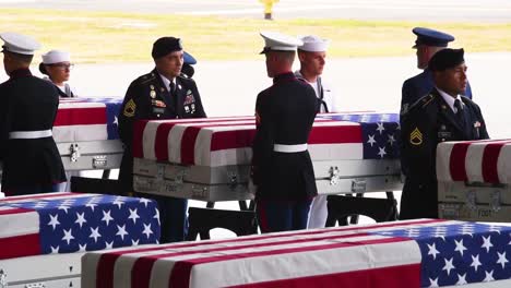 Flag-Draped-Coffins-Of-Dead-Us-Soldiers-Being-Returned-Home-Are-Displayed-In-A-Military-Hangar-2