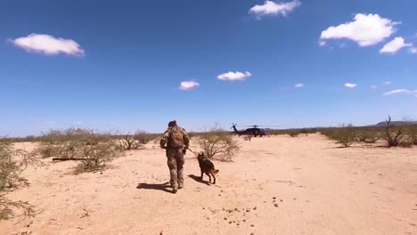 A-Member-Of-The-Us-Border-Patrol-Runs-Along-The-Us-Mexico-Border-To-A-Waiting-Helicopter